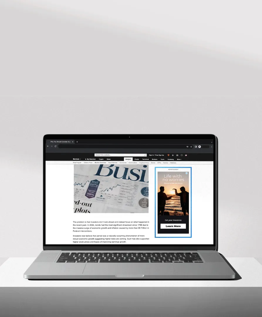 Laptop showing a premium display ad placement on a news website